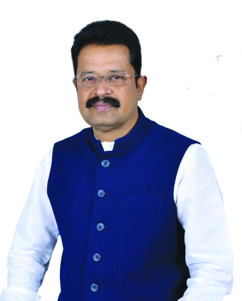 Interview Times feature on Er Iswar Chandra Panigrahi, featuring his portrait and coverage of cooperative banking and Koraput coffee.
